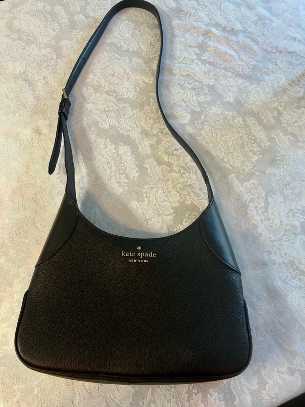 kate spade Black Pebbled Leather Crescent Shoulder Bag, Logo adjustable strap.